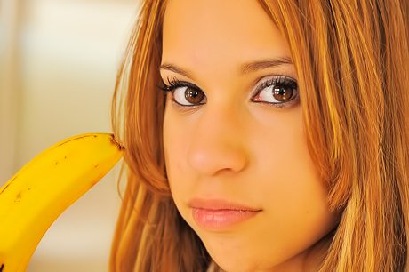 Effortlessly adorable babe going bananas with her oversized banana