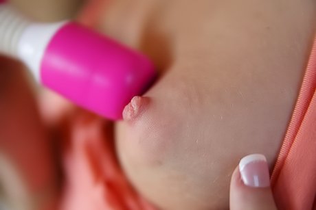 Attractive blonde with a winning smile fucks herself with a dildo on cam