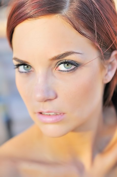 Redheaded bombshell gives you close-ups of her pussy, asshole, and feet