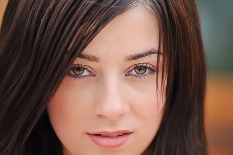 Immaculate brunette exposing her all-natural titties for the camera