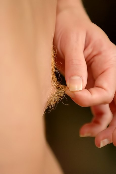 Breathtaking babe pulling out her own pussy hair and masturbating