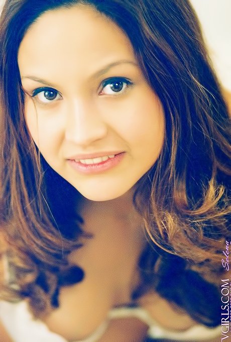 Thoughtful seductress with deep eyes shows her boobies as well