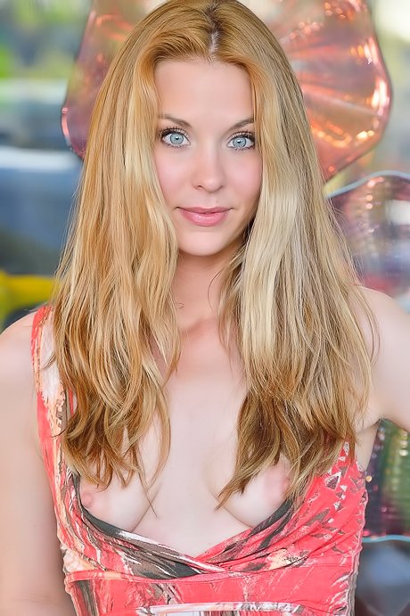 Blonde in a colorful dress flashes her pasty ass and pink pussy