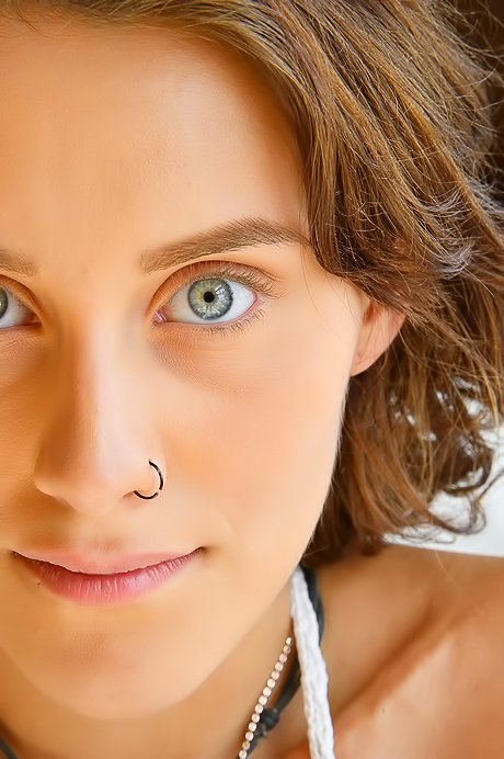 Short-haired babe shows her baby bump and lactating breasts too