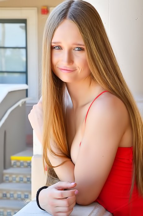 Red dress blonde showing her sexy feet and legs in a solo gallery